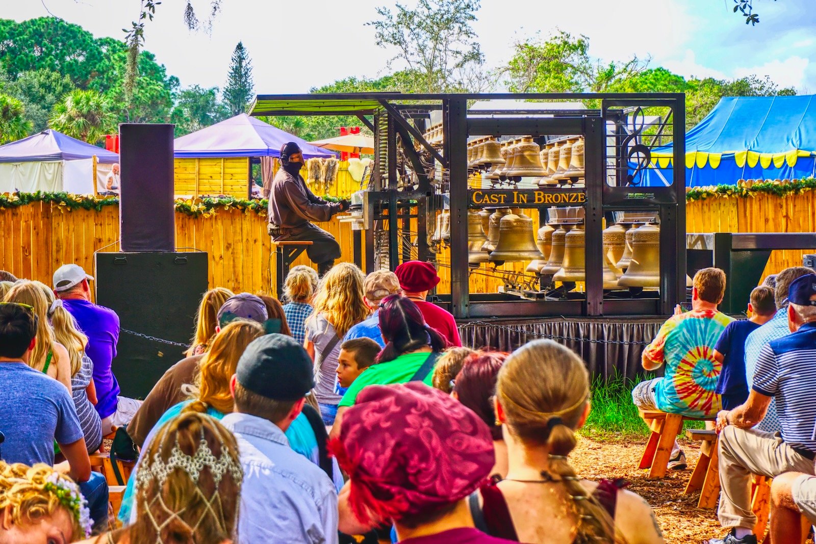 Masked carillon performer at Sarasota Medieval Fair