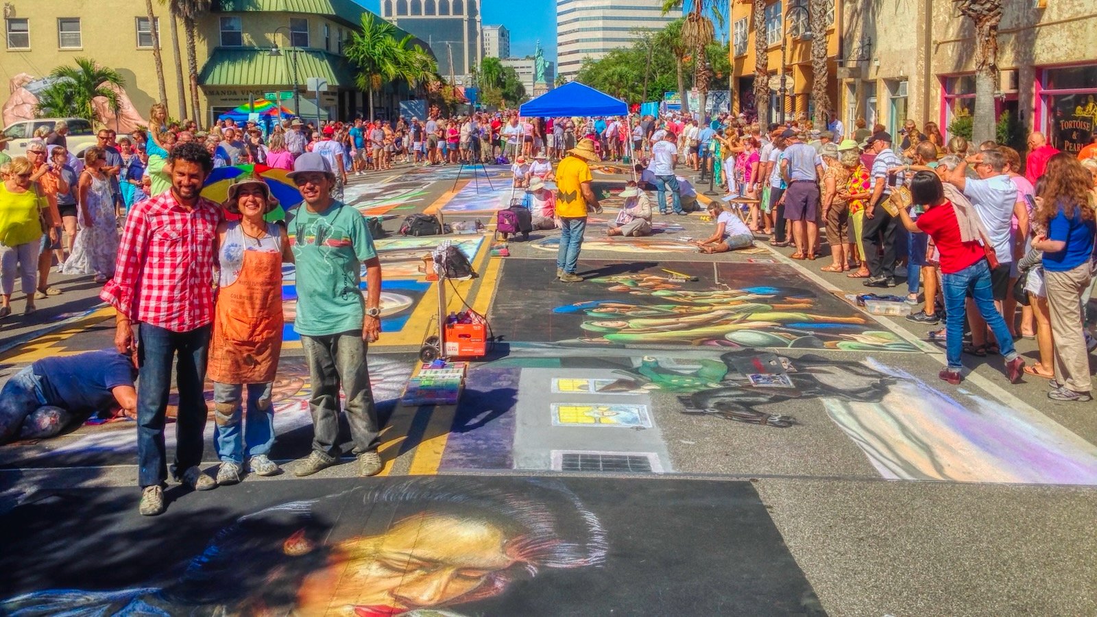 sarasota chalk artists pose for photos after completing their masterpieces in Sarasota's hot November temps