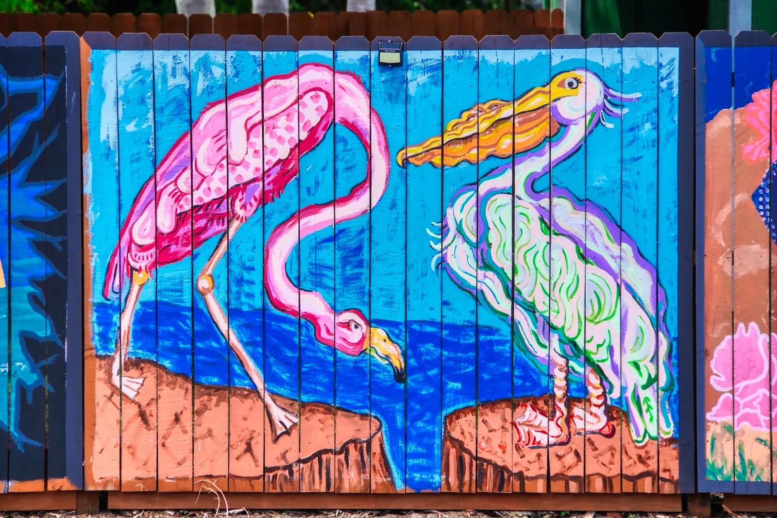 fence art sarasota pelican & flamingo