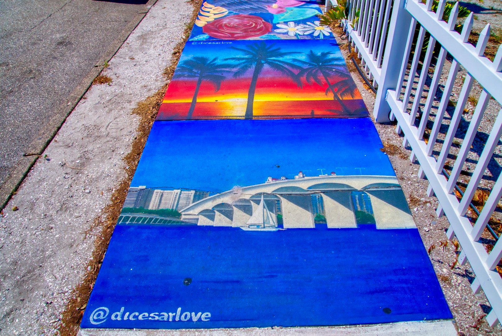 The Ringling Causeway & gorgeous sunset appear in Sarasota sidewalk art