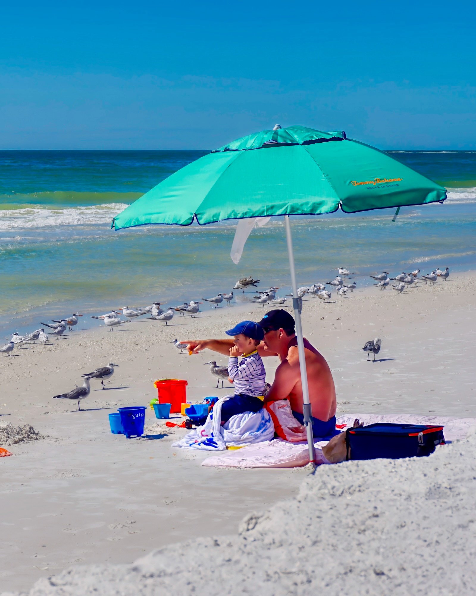 Siesta Key Beach for Families - enjoying the beach from under an umbrella