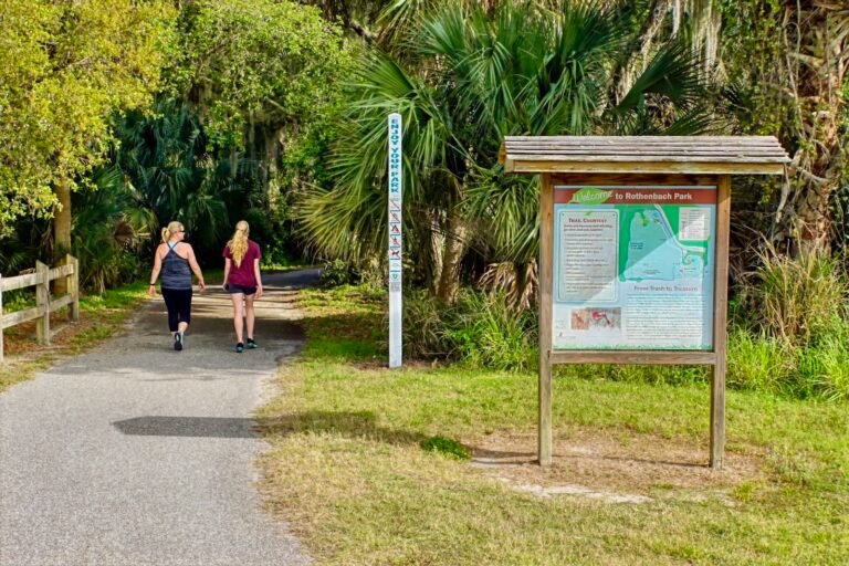 mother & daughter stroll the canopied trail at Rothenbach Park Sarasota