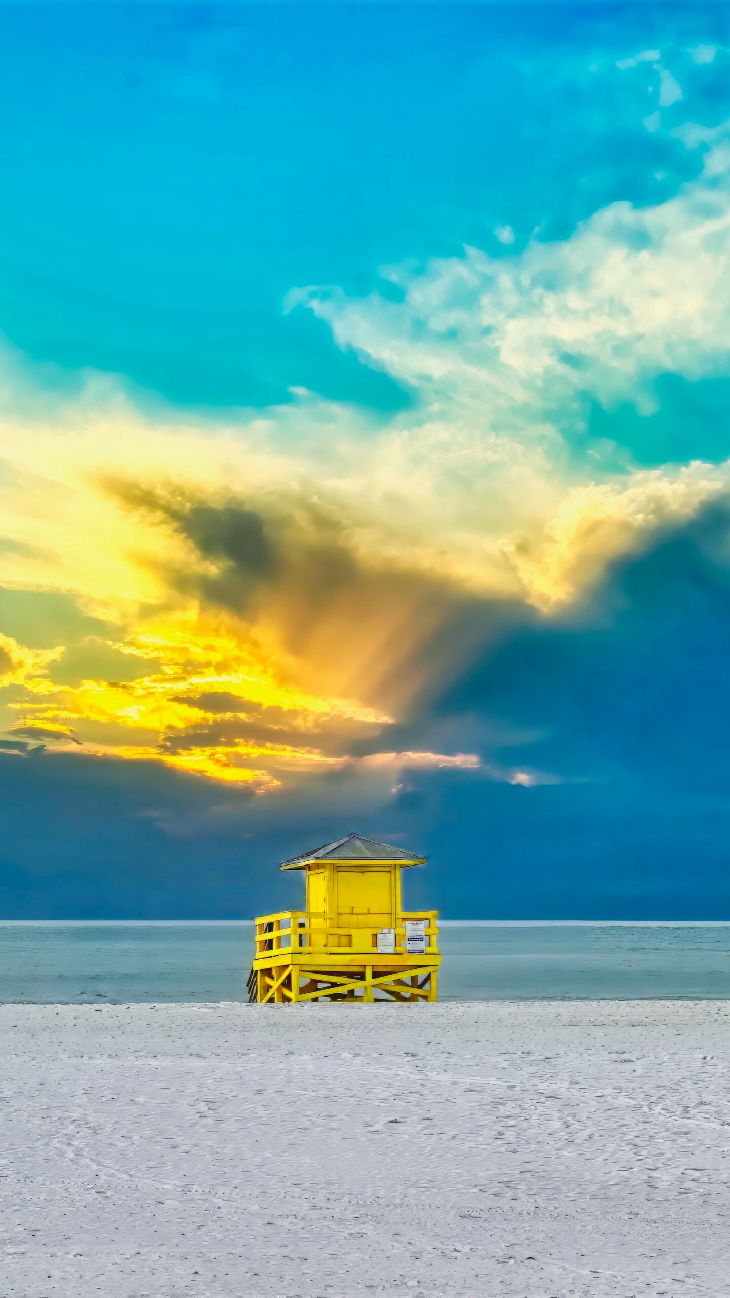 sarasota lifeguard stands - cold, wintry day on Siesta with a fiery sunset