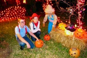 two kids enjoy trick-or-treating for Halloween