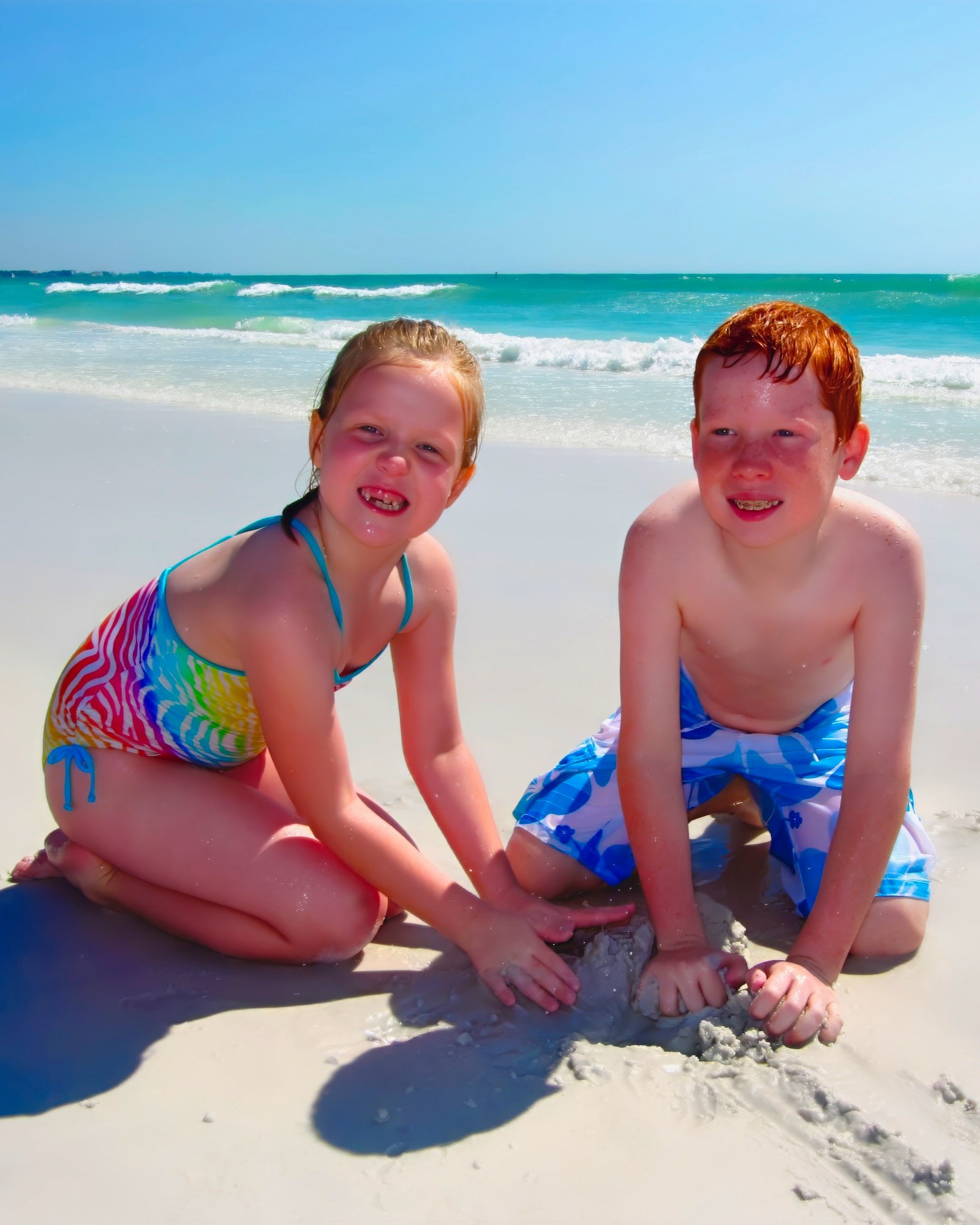Siesta Key Beach for Families - 2 kids play at the water's edge